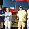 Louis Gibbs (Buck Finn) of Stuttgart handing over a check to Chief Andrew Fraize, and Mayor Robert Patrick with a donation of $2000 to the St. Charles Fire Dept