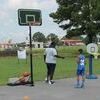 Jamarion Cohen participates in the basketball competition as Coach Kenae Guiden gives him a few pointers