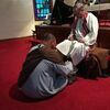 Seth place(Jesus) washes the feet of Eddie Best(Simon Peter)