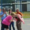 Julie Amstutz, Principle kissing the adult pig “cris-p-bacon”. The principles had to kiss the pigs since the students reached their largest goal of 17,500 Accelerated Reader Points!