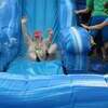 Emily Golden splashes into the adventure run at the first obstacle - the water slide. ​