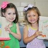 Molly McClain and Presley Adams are thrilled to show off their new Bibles and beautifully decorated covers.