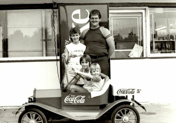 Guy and Sharon Wheatley with Donya Connelly and Brandon Wheatley. Won drawing at Neals grocery for Coke Car.