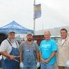The Centerpoint Energy team members donated their time and culinary skills to cook over 200 hot dogs, and served them with chips, cookies, and water. Members are (l-r): Brad Cummings, Don Milliken, Johnny Lockley, and Dakota Wilkins.