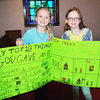Emma Cariker &amp; Chloe-Belle show off their top 10 things I am thankful to God posterboards.