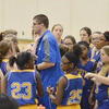 The 7th Grade Dragonettes, with no shortage of players, listen for instructions from Coach Clinton