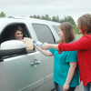 Tricia Rawls and Tracy Russell deliver Kelli Mortons food