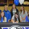 Peyton officially signs while her sister, Zoe Gasaway and mother, Stephanie Cotton look on with pride. Along with members of the senior golf teammates who Peyton wanted with her: Taylor Jo Mannis, Abbey Baker, Karli Rieves, and Taylor Mannis.
