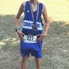 Marshall Eggerman proudly wears the medal he received for placing in the Top 10 out of 238 runners during the Lake Hamilton Invitational. Marshall ran this same race in 2016 as a 7th grader and only placed 110th out of 351 runners.