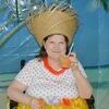 Carol Simpson has on her hula skirt and hat at Crestpark.
