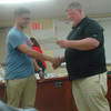 School Board President Brad Koen presenting Jordan Davis with All State Bowling and All State Jazz Band award.