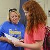 Melissa Grantham, helps her daughter Mary-Claire with class location in the new DMS