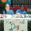 Rylee Dumond and Paige Howard sell homemade dog toys the girl scouts made