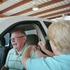 Donna Glidewell gives Phil English his flu shot.